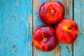 Fresh organic flat nectarines on an old wooden background Royalty Free Stock Photo