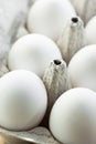 Fresh organic free range white eggs in cardboard box on wood kitchen table. Macro shot with eggshell texture. Baking cooking Royalty Free Stock Photo