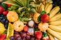 Fresh organic fruits background. Healthy eating concept. Fresh, exotic, organic fruits, light snacks in a plate on a Royalty Free Stock Photo