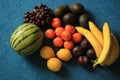 Fresh Organic fruits on blue background