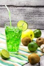 Fresh organic fruits cocktail on colorful background, fresh, tasty and healthy fruits cocktail. Green cocktail juice with apple, k Royalty Free Stock Photo