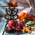 Fresh organic fruits, many colors, avocado, mango, nuts, garnet, mandarin and vintage scales on the wooden background. Royalty Free Stock Photo