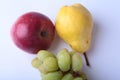 Fresh organic fruits on white background. Assorted apple, pear and grapes.