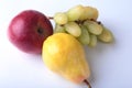 Fresh organic fruits on white background. Assorted apple, pear and grapes.