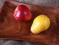 Fresh organic fruits on wooden Serving tray. Assorted pear and apple. Royalty Free Stock Photo