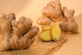 Fresh organic ginger rhizome root used in traditional medicines. Creative photo Earth tones natural background. Royalty Free Stock Photo