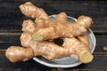 Fresh organic ginger rhizome root used in traditional medicines and for flavoring meals, drinks worldwide Royalty Free Stock Photo