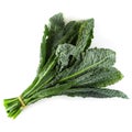 Fresh organic green kale leaves isolated over white background Royalty Free Stock Photo