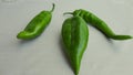 Ripe organic green pepper on a white background