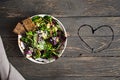 Fresh organic green quinoa salad bowl on dark wooden background
