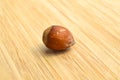 Fresh organic hazelnuts filbert, on bamboo cutting board