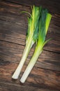 Fresh organic leeks tied on an old wooden board Royalty Free Stock Photo