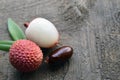 Fresh organic lychee fruits on a rustic wooden background.Exotic tropical litchi berry. Litchee.Raw diet or vegan food concept wit