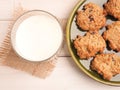 Fresh organic milk and tasty oatmeal cookies on a white wooden table, view from above Royalty Free Stock Photo