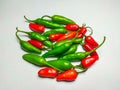 Fresh organic mixes chili pile on white Background.