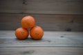 Healthy food photography image of fresh organic oranges with happy drawn on smile on rustic wood background with copy space