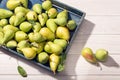 Fresh organic pears in crate on wooden table Royalty Free Stock Photo