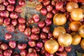 Fresh organic pile of red shallots and onions on net fabric background, selective focus, selling in market for food ingredient Royalty Free Stock Photo