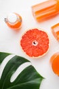 Fresh organic pink grapefruit juice, on white stone table background, top view flat lay Royalty Free Stock Photo