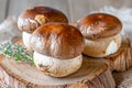 Fresh Organic Portobello Mushrooms on Rustic Wooden Cutting Board with Herbs