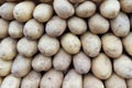 Fresh Organic Potatoes Stack on Market Stall Royalty Free Stock Photo