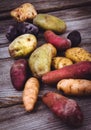 Fresh organic potatoes varieties over plank Royalty Free Stock Photo