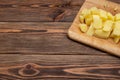 Fresh organic products. Raw Potatoes Diced. Wooden plank. Flat lay