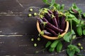 Fresh organic purple green peas in a wooden bowl on rustic wooden table. Royalty Free Stock Photo