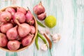 Fresh organic red onion in wooden bowl Royalty Free Stock Photo