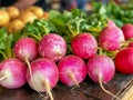 Fresh Organic Red Radishes on Display at Local Farmer\'s Market with Vibrant Green Tops