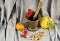 Fresh organic ripe fruits quince nuts plum berries natural gourmet product dessert bronze mortar and pestle