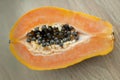 Fresh organic ripe papaya fruit cut in half on a wooden board. Exotic fruits, healthy eating concept Royalty Free Stock Photo