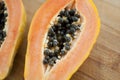 Fresh organic ripe papaya fruit cut in half on a wooden board. Exotic fruits, healthy eating concept Royalty Free Stock Photo
