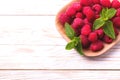 Fresh organic ripe raspberry with mint leaves in tray Royalty Free Stock Photo