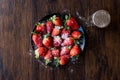 Fresh Organic Ripe Strawberries with Powdered Sugar on Black Plate. Royalty Free Stock Photo