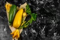 Fresh organic summer vegetables zucchini on chopping board on rustic background. Top view, space for text Royalty Free Stock Photo