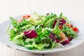 Fresh organic super food salad on white plate with fork on side Royalty Free Stock Photo