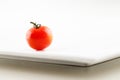 A fresh organic tomato with water droplets Royalty Free Stock Photo