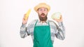 Fresh organic vegetable harvest. Hipster gardener in apron hold vegetable. Man bearded presenting corncob maize and