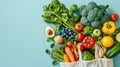 Fresh organic vegetables on blue pastel background for a balanced diet. Healthy food concept. Copy space Royalty Free Stock Photo