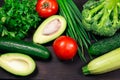 Fresh organic vegetables on a dark wooden background. Top view. Concept of vegetarian, diet food. Healthy vitamin food to protect