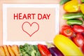 Fresh organic vegetables and frame with text, HEART DAY.