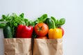 Fresh organic vegetables and fruits in a recycled paper shopping bag isolated on white background with copy space Royalty Free Stock Photo