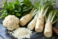 Fresh Organic Vegetables on Slate Background Cauliflower, Parsley, and Parsnips Ready for Cooking