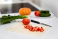 Fresh organic vegetables on white table in kitchen