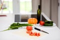 Fresh organic vegetables on white table in kitchen