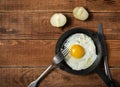 Fresh organic village eggs on wooden table, healthy food,  village food. black pan with fried egg. Royalty Free Stock Photo