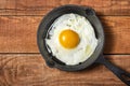 Fresh organic village eggs on wooden table, healthy food,  village food. black pan with fried egg. Royalty Free Stock Photo