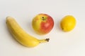 Fresh organic yellow banana, lemon and red apple