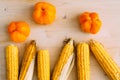 Fresh organic yellow sweet corn and pepper on wooden table. Top view Royalty Free Stock Photo